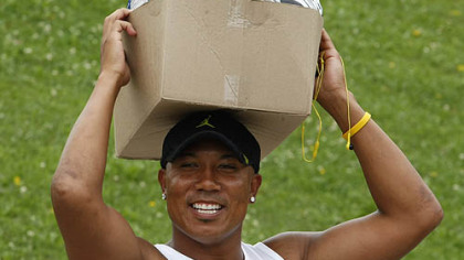 Steelers wide receiver Hines Ward carries a box on his head as he arrives at training camp.