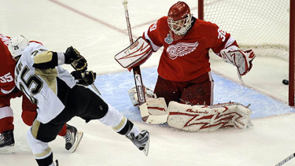 Penguins center Max Talbot scores against Red Wings goaltender Chris Osgood in the second period of Game 7 of the Stanley Cup Final. The game set a local television ratings record.