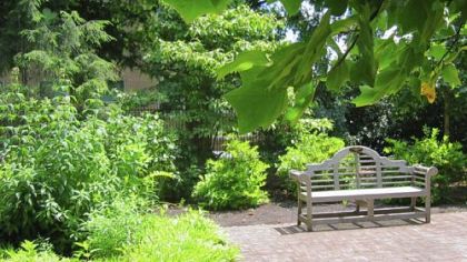 A bench named in honor of former Gov. Milton Shapp sits in the garden of the governor's residence in Harrisburg.