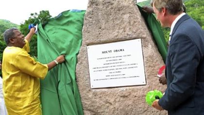 Antigua and Barbuda's Prime Minister Baldwin Spencer, left, unveils a stone monument and plaque honoring President Barack Obama as Brent Hardt, charge d'affairs of the U.S. embassy in Barbados, looks on during a ceremony naming Antigua's highest mountain "Mount Obama" in St. John's, Antigua, on Aug. 4. The small Caribbean nation celebrated the American president on his 48th birthday and saluted him as a symbol of black achievement.