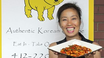 Yong Kwon, owner and chef at the Golden Pig, with Oh Jing Un Bockeum (spicy, boiled squid).