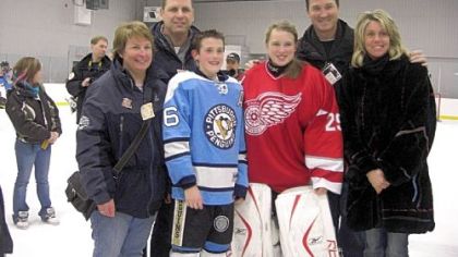 From left, Trina Crosby, Troy Crosby, Austin Lemieux, Taylor Crosby, Mario Lemieux and Nathalie Lemieux pose for a photograph at a peewee tournament last month in Quebec where Austin's and Taylor's teams met in a special exhibition game.