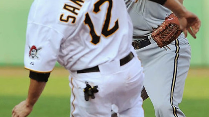 Brewers shortstop JJ Hardy turns double play over Pirates second baseman Freddy Sanchez.
