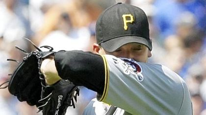 Pirates starting pitcher Charlie Morton wipes sweat from his face during the second inning of Friday's loss to the Cubs.