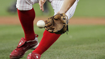 Phillies pitcher Joe Blanton fields a ground ball hit by Pirates catcher Ryan Doumit in the first inning of last night's game.