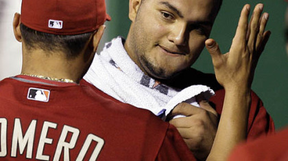 Diamondbacks pitcher Yusmeiro Petit, right, celebrates with teammate Alex Romero after pitching eight innings.