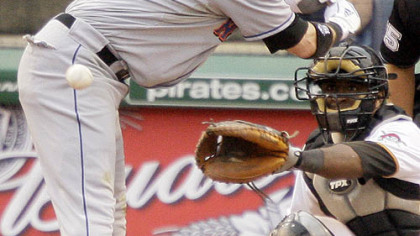 Mets outfielder Ryan Church gets out of the way of an inside pitch from Pirates pitcher Steven Jackson during the eighth inning yesterday.
