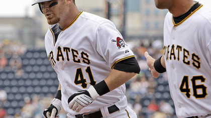 Pirates catcher Ryan Doumit (41) is greeted by first baseman Garrett Jones (46) after hitting a first-inning solo home run off Brewers pitcher Jeff Suppan.