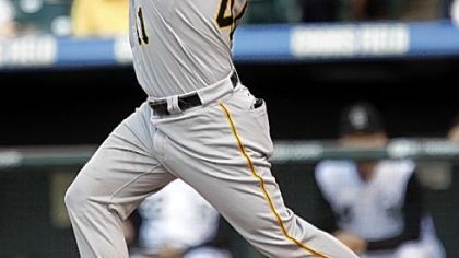 Ryan Doumit watches the flight of his second-inning double last night against the Rockies in Coors Field.