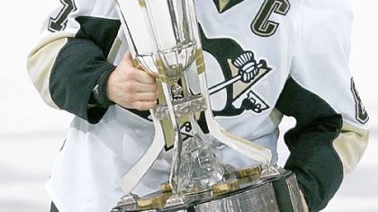 Sidney Crosby holds the Prince of Wales Trophy in Raleigh, N.C., Tuesday.