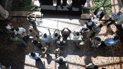 Fans walk past and take photos of the Philadelphia Phillie's World Series Trophy, the Pittsburgh Steeler's Vince Lombardi Trophy and the Pittsburgh Penguin's Stanley Cup Trophy on display in the East Wing Rotunda of the state Capitol.