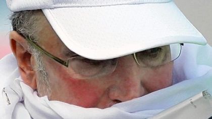 Lockerbie bomber Abdel Baset al-Megrahi holds his prisoner release papers as he walks toward the airplane  at Glasgow International Airport,  Glasgow Scotland  bound for Tripoli, yesterday.