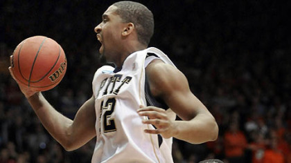 DeJuan Blair reacts beside teammate Brad Wanamaker after getting a basket late in the second half Sunday against Oklahoma State in the second round of the NCAA tournament in Dayton, Ohio.