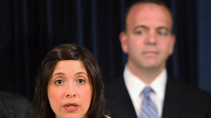 Heather Arnet, executive director of the Women & Girls Foundation, thanks  Allegheny County Executive Dan Onorato (background) yesterday for taking a strong stand on pay equity.