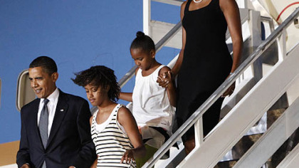 President Barack Obama and first lady Michelle Obama arrive in Accra, Ghana with their daughters Sasha and Malia on Friday.