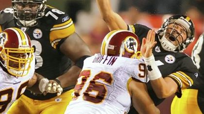Washington's Cornelius Griffin drives into Charlie Batch in the first half of last night's preseason game in Landover, Md. Batch started in place of Ben Roethlisberger.