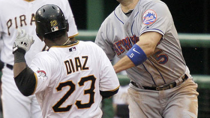 Pirates catcher Robinzon Diaz is tagged out by Mets third baseman David Wright during the eighth inning yesterday's game. Diaz was tagged out on a grounder by Pirates outfielder Andrew McCutchen, who was safe at first.