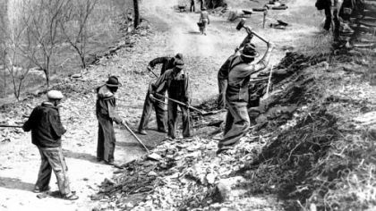 A Works Progress Administration crew builds a new farm-to-market road along Knob Creek in Tennessee in March 1936.