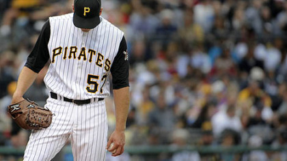 Pirates starter Zack Duke hangs his head after giving up his sixth run of the afternoon against the Braves yesterday at PNC Park.