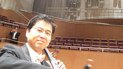 Chinese-born Pittsburgh Symphony Orchestra musician Adam Liu warms up at the Oriental Arts Center in Shanghai.