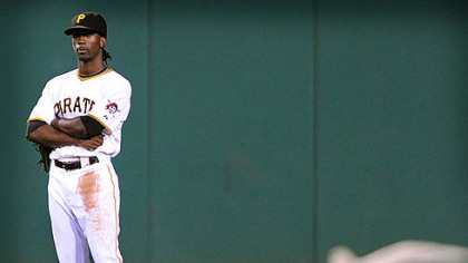 Pirates outfielder Andrew McCutchen waits for a bird to makes its way past him in the seventh inning against the Brewers last night at PNC Park.