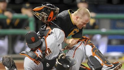 Pirates outfielder Brandon Moss collides with Giants catcher Bengie Molina in the seventh inning.