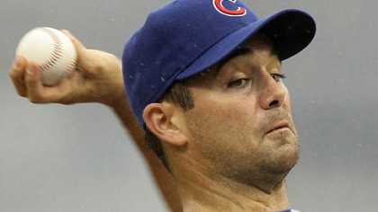 Cubs pitcher Ted Lilly throws in the first inning.