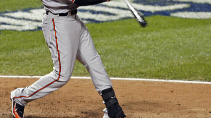 Orioles outfielder Adam Jones hits a sacrifice fly to score Tigers outfielder Curtis Granderson during the eighth inning.