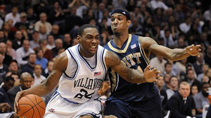 Villanova's Corey Stokes, left, drives past Pitt's Gilbert Brown during the second half of last night's game in Philadelphia.