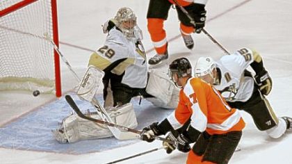 Jeff Carter beats Sergei Gonchar and goalie Marc-Andre Fleury for the Flyers' first goal in Game 3 of the first-round playoff series.