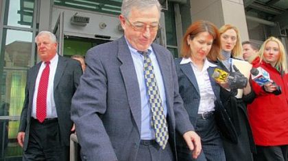 Luzerne County judges Mark A. Ciavarella, center, and Michael T. Conahan, far left, leave the William J. Nealon Federal Building and United States Courthouse in Scranton on Thursday after pleading guilty to corruption charges.