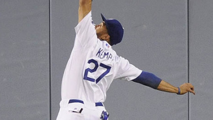 Dodgers outfielder Matt Kemp catches a ball hit by Pirates outfielder Lastings Milledge for a out during the fourth inning.