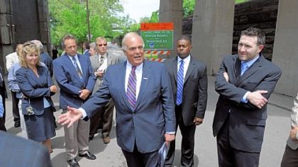 Gov. Ed Rendell speaks with reporters and local officials after a press conference beneath the Beaver-Rochester Bridge, where he announced the start of a $10 million rehabilitation of the span, which carries Route 51 over the Beaver River. The project is expected to employ 40 people and five Pennsylvania companies.