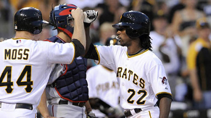 Andrew McCutchen is congratulated by teammate Brandon Moss after hitting a home run against the Nationals in the fourth inning last
night.