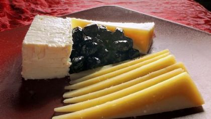 Cheeses from Greece, clockwise from left: Feta, kefalotiri and graviera with oil-cured olives, all from Salonika Imports in Lawrenceville.