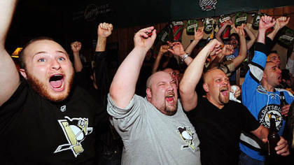 Fans celebrate at Shale's Cafe on Fifth Avenue as the Penguins win the Stanley Cup, beating the Red Wings 2-1 in Detroit.