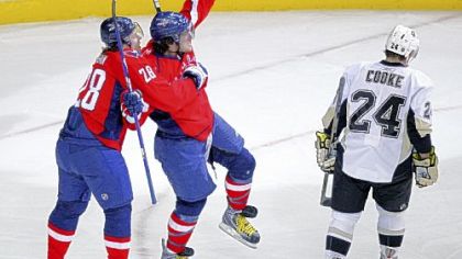 Capitals left wing Alex Ovechkin, center, celebrates his goal with Alexander Semin as Matt Cooke skates by in the first period yesterday in Washington.