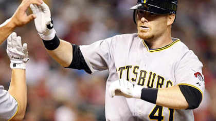 Pirates catcher Ryan Doumit is congratulated after hitting a two-run home run.