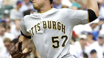 Starting pitcher Zach Duke delivers during the first inning of Saturday's loss to the Cubs at Wrigley Field in Chicago.