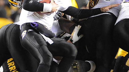 Troy Polamalu stops Ravens quarterback Joe Flacco on fourth-and-1 in the first half last night at Heinz Field.