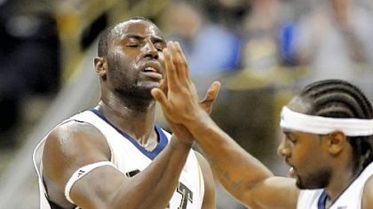 DeJuan Blair and Levance Fields exchange a high-five after beating South Florida Wednesday.