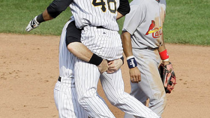 Pirates outfielder Garrett Jones follows through on a solo home run off Brewers pitcher Carlos Villanueva in the sixth inning.