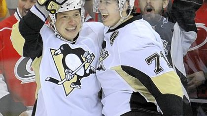 Ruslan Fedotenko celebrates his third-period goal with Evgeni Malkin Saturday against the Hurricanes at the RBC Center in Raleigh, N.C.