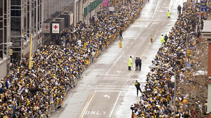 Fans line the Boulevard of the Allies awaiting the start of the Steelers Super Bowl parade, Downtown.