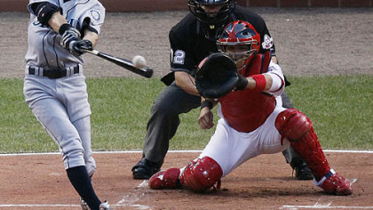 Mariners outfielder Ichiro Suzuki singles to right field during the first inning.