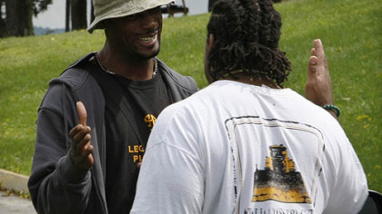 Steelers wide receiver Limas Sweed, left, greets offensive lineman Willie Colon as they arrive at training camp.