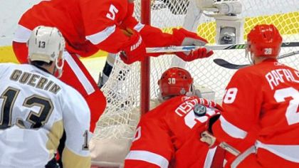 What's that about preferring to be lucky rather than good? The puck ends up on the back of Detroit goalie Chris Osgood late in last night's game in Detroit.