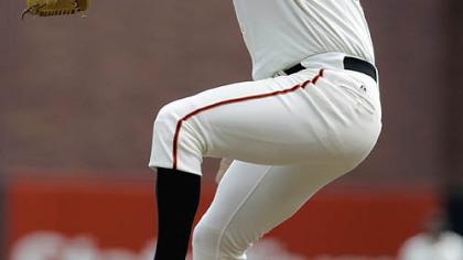 Giants pitcher Matt Cain works against the Pirates during the first inning.