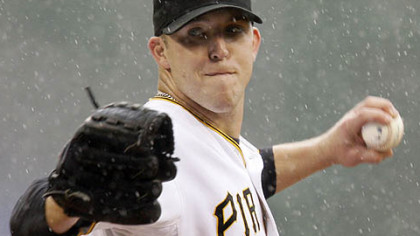 Pirates pitcher Paul Maholm throws in the first inning against the Mets yesterday.