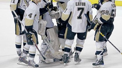 Penguins goalie Marc-Andre Fleury, third from left, is congratulated by teammates after making 31 saves to beat the Florida Panthers last night in Sunrise, Fla.